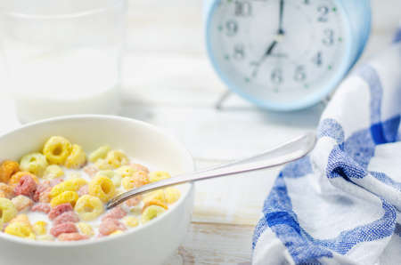 Morning meal, Colorful cereal with milk in white bowl