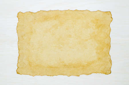 Blank antique old paper on white wooden background, Old vintage paper on white backgroundの写真素材