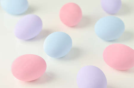 Beautiful pastel easter eggs on white table background, Easter background