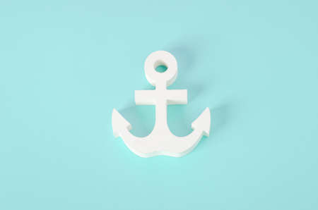 White wooden Anchor model on blue background - Nautical backgroundの写真素材