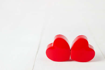 Close up of couple red heart on white wooden background - Valentine backgroundの写真素材