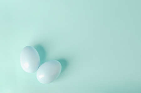 Blue pastel easter eggs on blue backgroundの写真素材