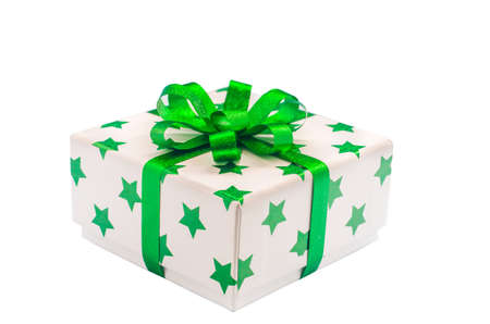 Whie gift box with green star pattern and green ribbon bow isolate on white background with clipping pathの写真素材