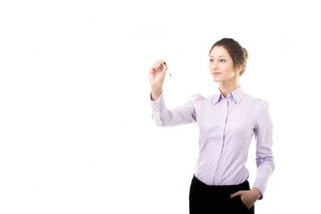 Beautiful girl writing on blank screen with pen, student or office woman in formal wear, copy spaceの写真素材