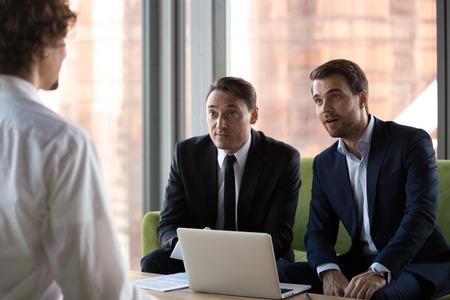 Surprised HR executive managers headhunters or recruitments looking at job vacancy candidature impressed by incredible achievements knowledges. Human resources interview, employment and hiring conceptの写真素材