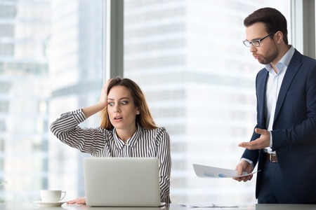 Angry boss scolding terrified stressed lazy female worker for bad work, shocked confused incompetent...