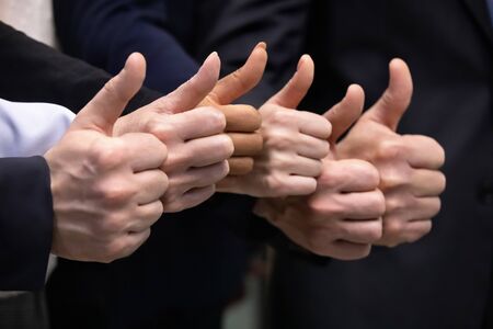 Close up of diverse businesspeople show thumbs up recommend good company business service,...