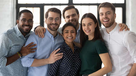 Portrait of diverse multi ethnic company staff, successful employees friendly associates standing in...
