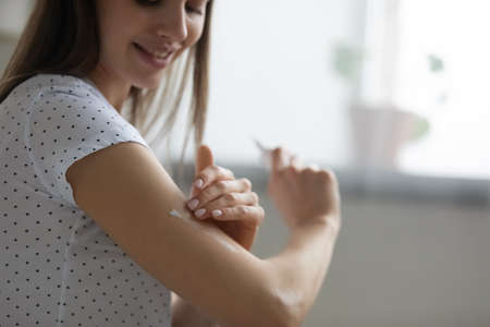 Crop close up of smiling young Caucasian woman do daily beauty spa procedures or treatment at home....