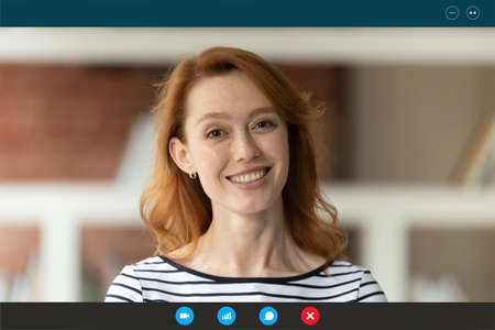 Head shot portrait screen view happy woman making video call, looking at camera, using webcam and...