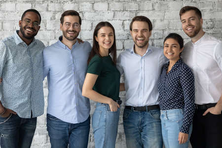When colleagues are friends. Group portrait of happy positive diverse young people of different...