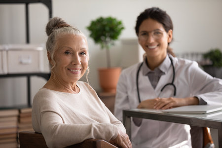 Portrait of smiling mature 70s woman patient feel satisfied with good quality medical service in modern clinic. Happy senior female client at consultation in hospital. Elderly healthcare concept.の写真素材