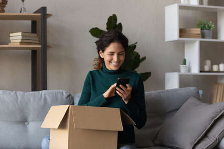 Thank you for surprise. Young latina female getting unexpected present by mail calling friend...