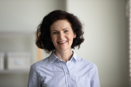 Happy confident mature businesswoman indoor head shot. Elder professional teacher, coach, boss...