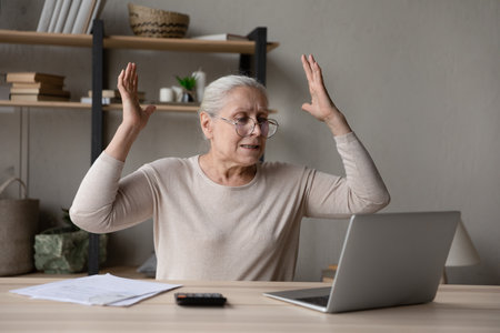 Frustrated angry landlady woman using laptop computer, getting problems, software mistakes, wrong...