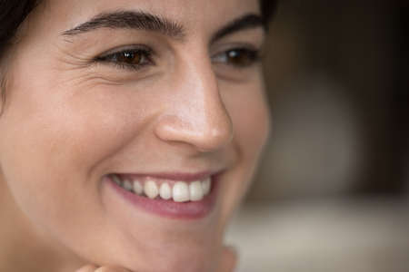 Happy Hispanic girl close up face portrait. Beautiful attractive young woman, pretty female beauty...