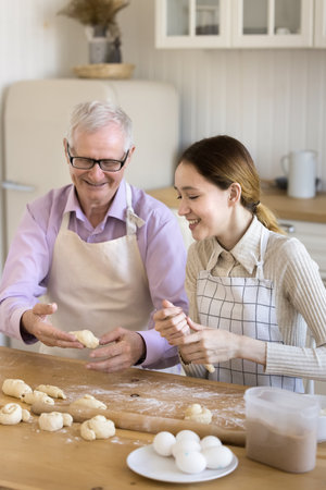 Happy granddad enjoying retirement, family meeting, domestic activities with teenage grandkid,...