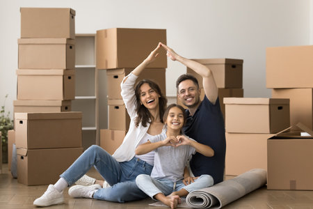 Happy young parents and kids promoting mortgage, house insurance, real estate property buying,...