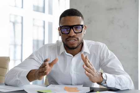 Virtual meeting by business, remote formal communication, videocall app usage concept. Young African...