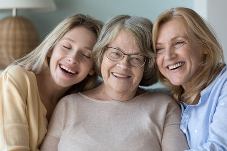 Three different age and generation women portrait. Happy elderly grandma, mature daughter,...