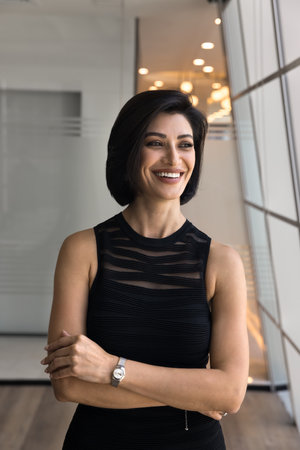 Experienced executive. Elegant mid aged woman business leader ceo in stylish casual dress posing at...