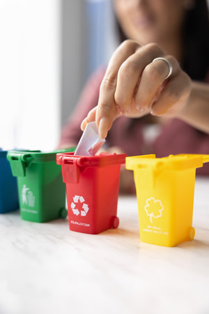 Young woman caring for ecology, promoting sustainable development, waste sorting, recycling...
