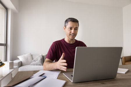Virtual work meeting. Confident young man freelancer remote working employee speak looking on...