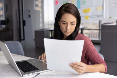 Paperwork for productivity. Serious young businesswoman project manager accountant prepare financial...