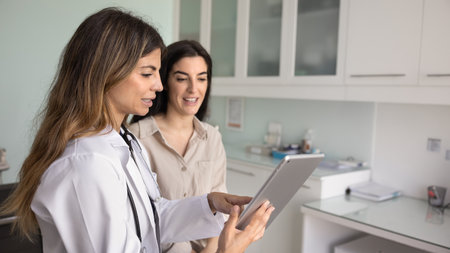 Positive young Hispanic doctor woman explaining examination report, diagnosis, prescription to...