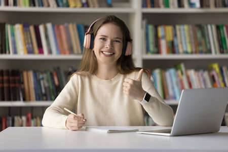 Motivated to study. Workplace portrait excited female zoomer high school student in digital...