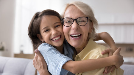Sincere laughter and joy uniting generations. Close up cute portrait laughing overjoyed older granny...