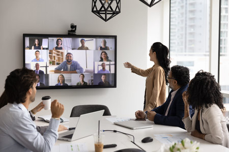 Networking and integration in modern business. Diverse polyethnic office team of coworkers hold...