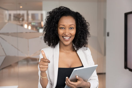 Positive attitude and recommendation. Head shot business portrait happy successful young Black...