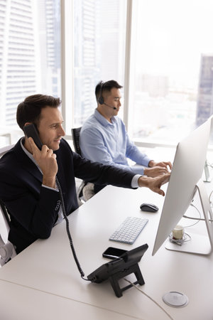 Call center peak hour. Busy diverse professional team client support operators hotline employees...