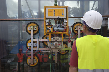 Worker placing glass