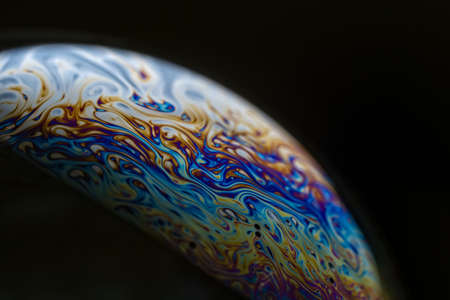 Macro photography of the colors and shapes seen in a soap bubbleの写真素材