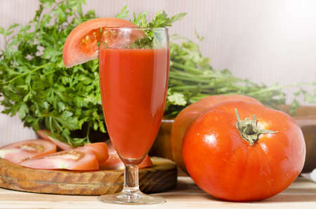 Glass with juice of tomatoの写真素材