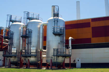 Industrial containers in factory with blue sky