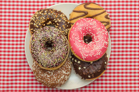Dish with several Donuts of different flavorsの写真素材