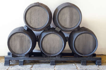 Former black barrels stacked in pyramid