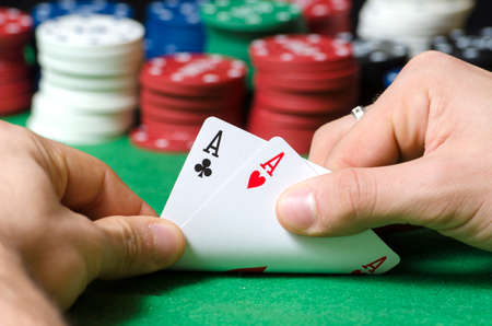 Closeup of hands with double ace