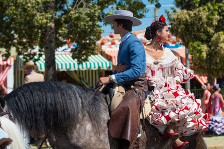 Seville, Spain, 8 may, 2014: People mounted on horse on fair of Seville. のeditorial素材