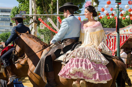 Seville, Spain, 8 may, 2014: People mounted on horse on fair of Seville.のeditorial素材