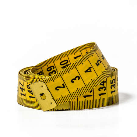 yellow meter sewing on white backgroundの写真素材
