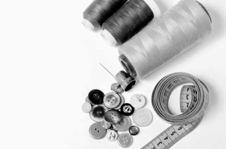 Sewing utensils, thread, thimble, needle and meter in black and whiteの写真素材