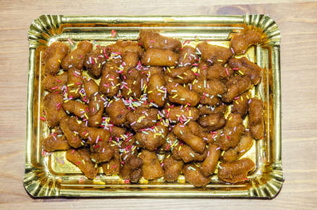 The fritters is a Christmas sweet, typical of Andalusia, made with dough, fried in olive oil and honey.の写真素材