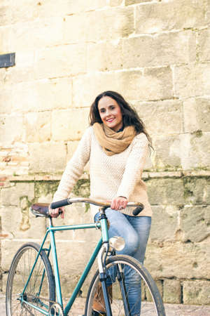 Adult woman with vintage bikeの写真素材