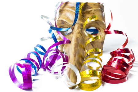 Carnival mask with colorful streamers on white backgroundの写真素材