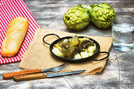 Stew of artichokes with potatoesの写真素材