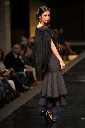 JEREZ DE LA FRONTERA, SPAIN - FEBRUARY 14: Models pictured on the catwalk during the âDoble Bâ Flamenca season fashion show at Pasarela Flamenca Jerez on feb 12, 2015 in Jerez de la frontera.のeditorial素材